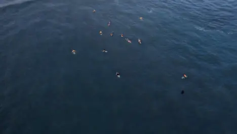 Drone Shot Orbiting a Group of Surfers Waiting for Waves