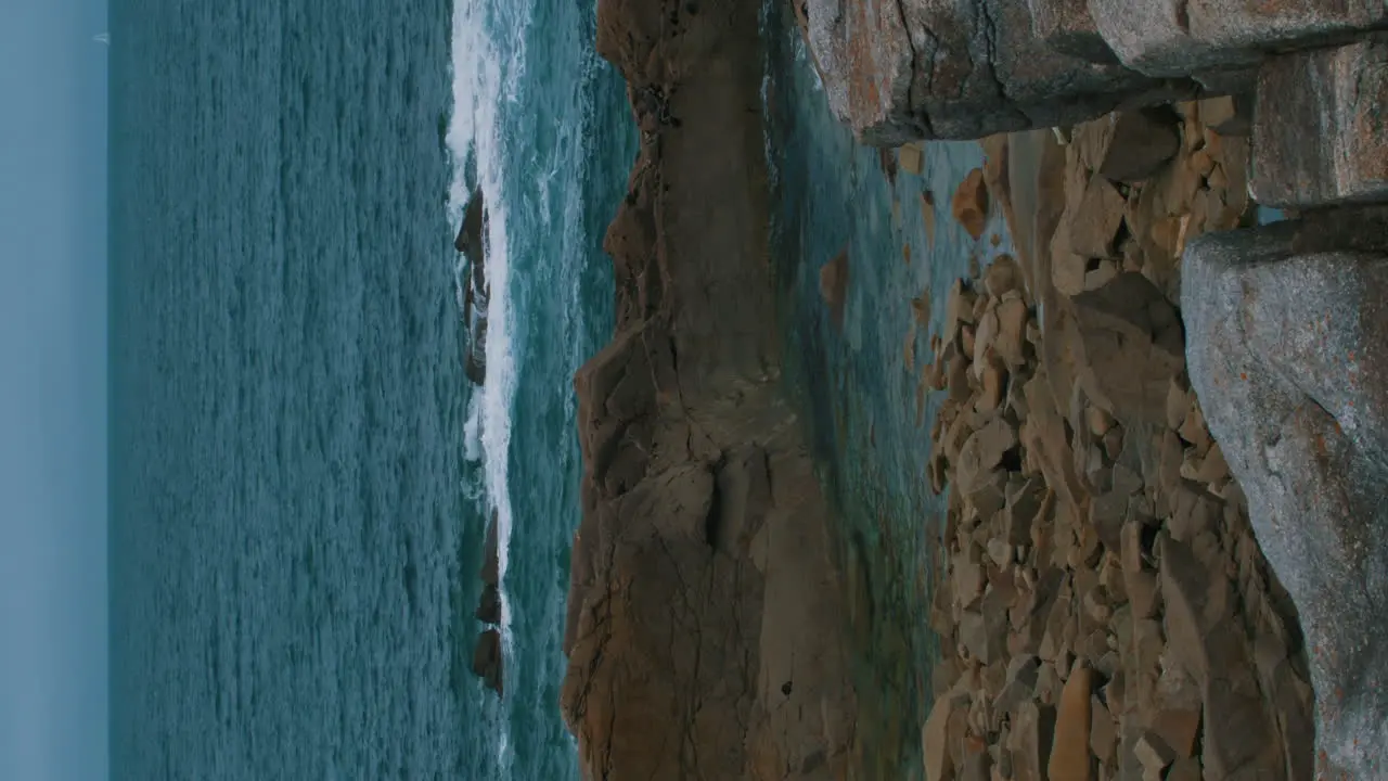 vertical video of blue atlantic ocean and cliffs of the Atlantic Ocean on the Island Île-Grande in Pleumeur-Bodou France Cote D'amour