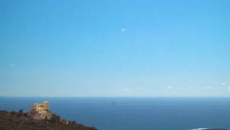 View From Cliffs With Building Of Coastline And Clear Blue Sea