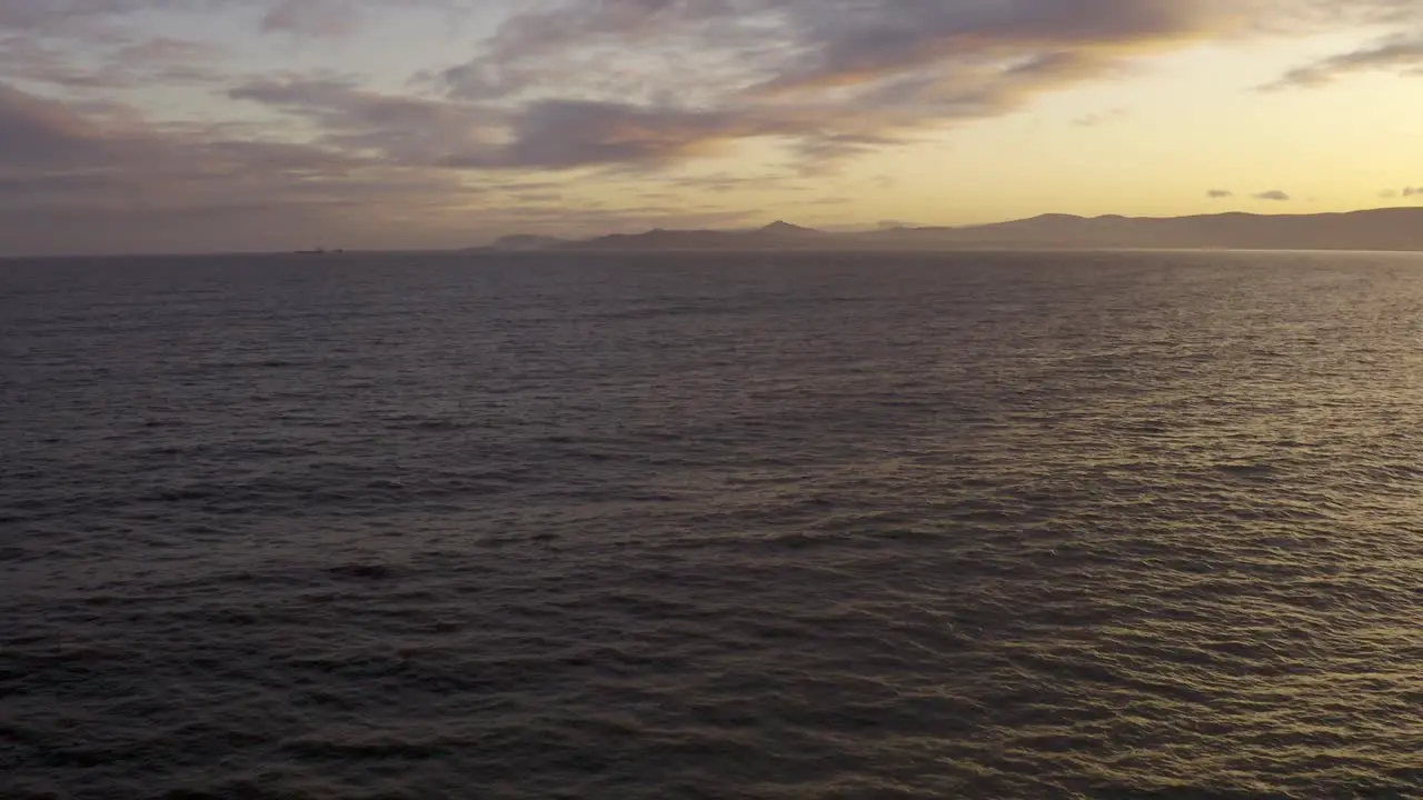 Drone shot over water in Dublin Bay on a calm evening