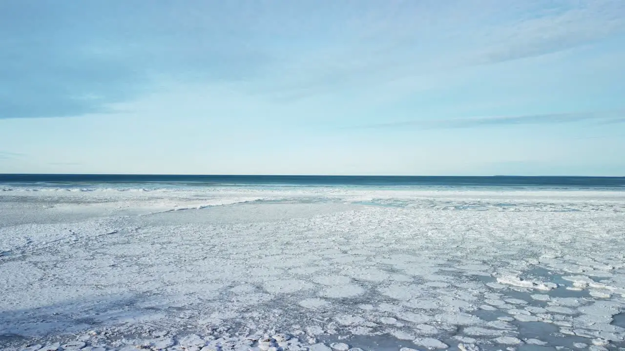 Aerial Drone shot frozen lake ice field frozen lake