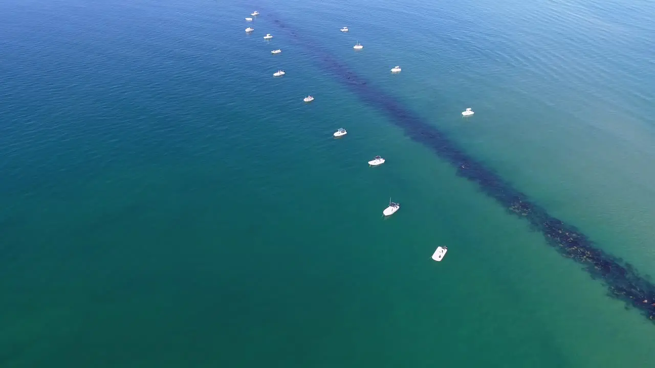 Boats fishing on a rock jetty off the Crystal Coast of North Carolina