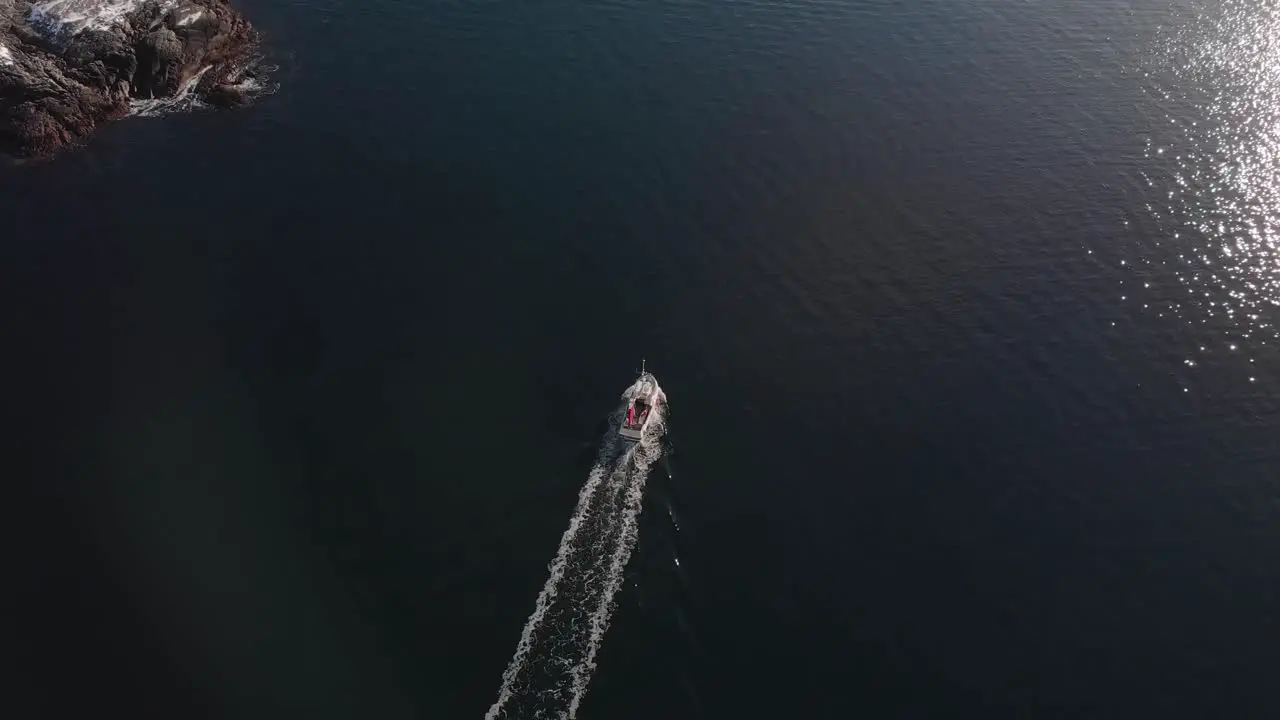 Drone shot chasing a boat in the Lofoten Islands Norway