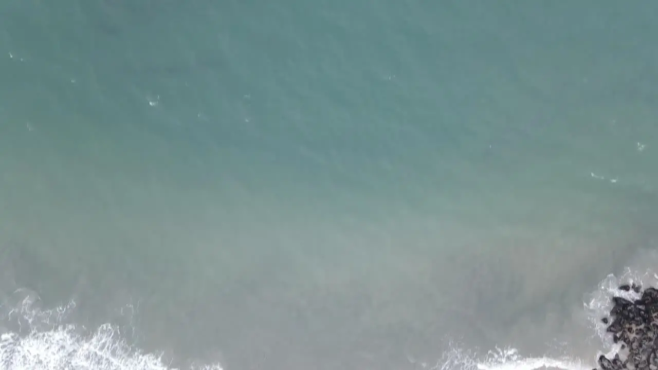 Aerial view of ocean waves at beach