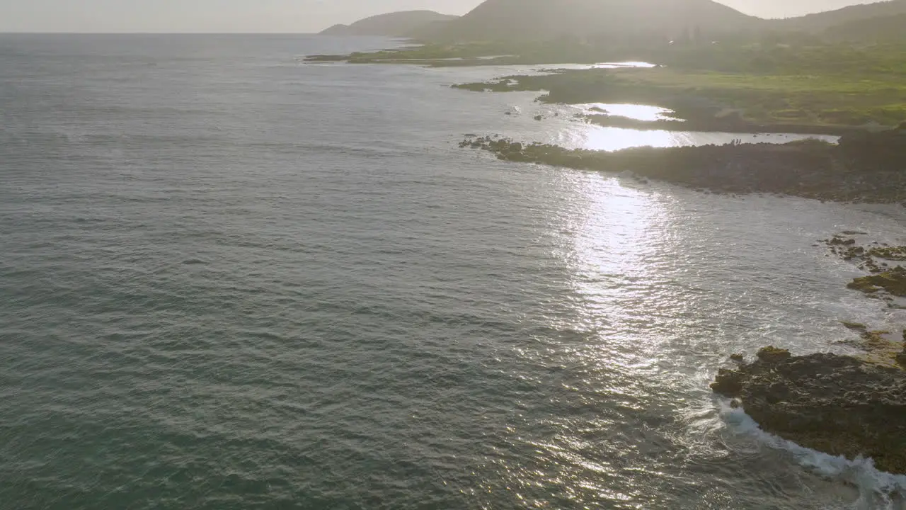 Pacific ocean in Oahu Hawaii at sunset with a pull back