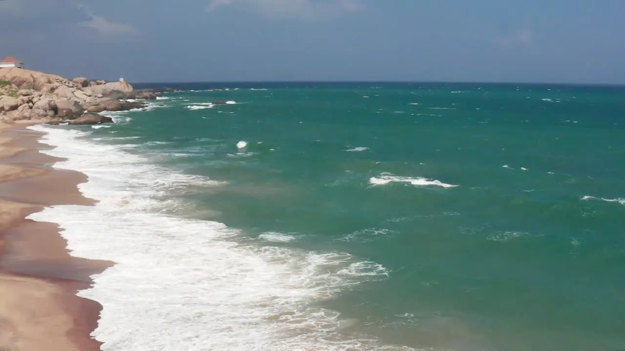 Ocean Waves crushing sandy and rocky coast  Awesome Top Drone view