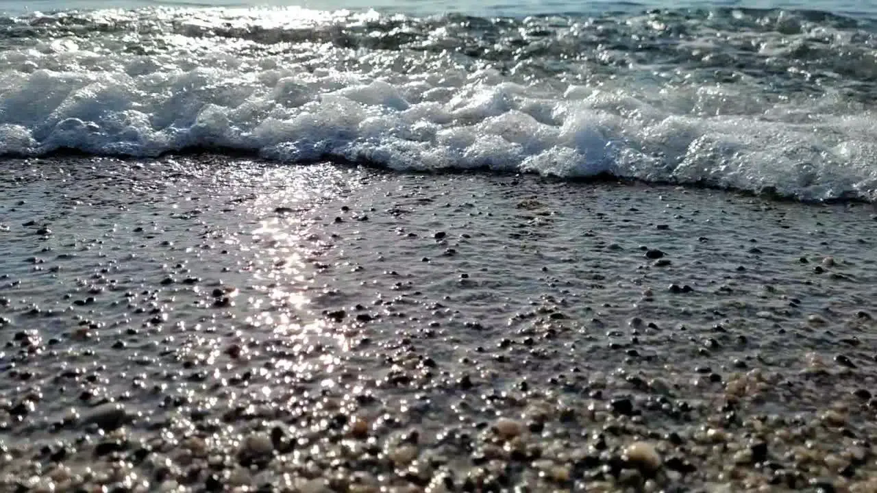 shore of barceloneta beach in slow motion