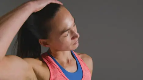 Close Up Shot of Young Woman Stretching at Gym