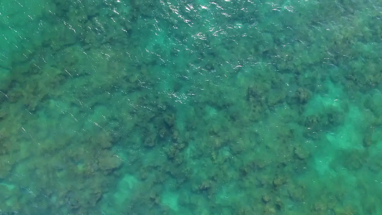 Aerial shot of turquoise Hawaiian waters near Diamond Head