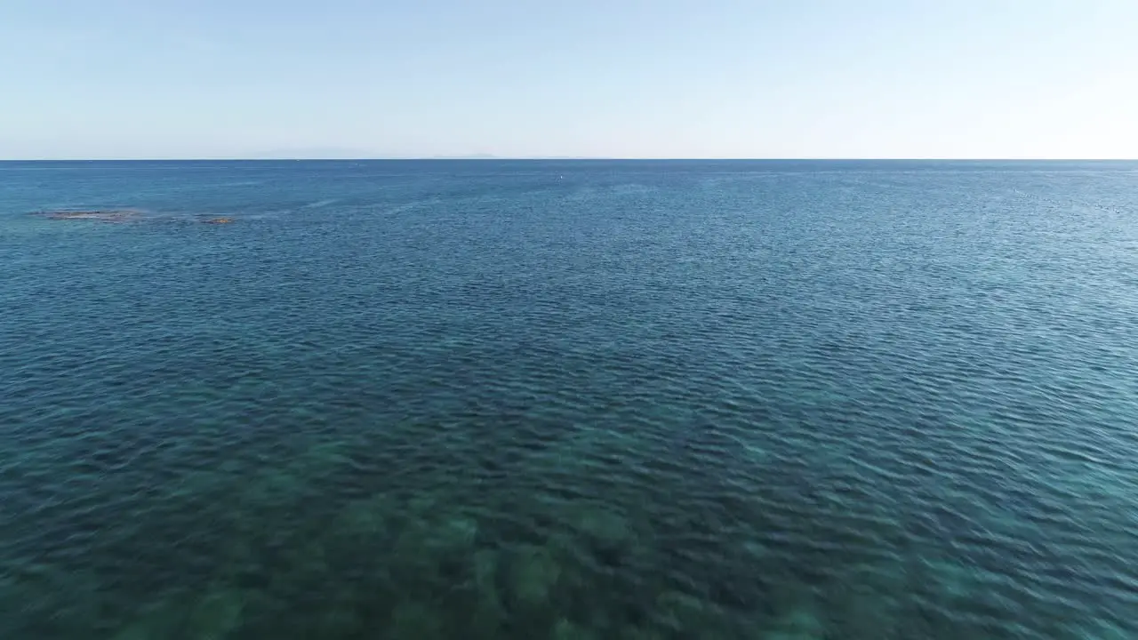 Native outrigger Bangka boat of Philippines floating in shallow water aerial