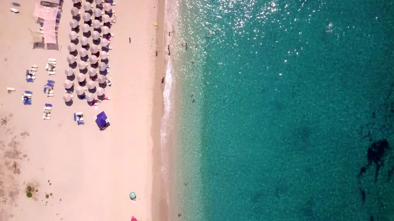 Exotic beach from above with ocean on the right 4K