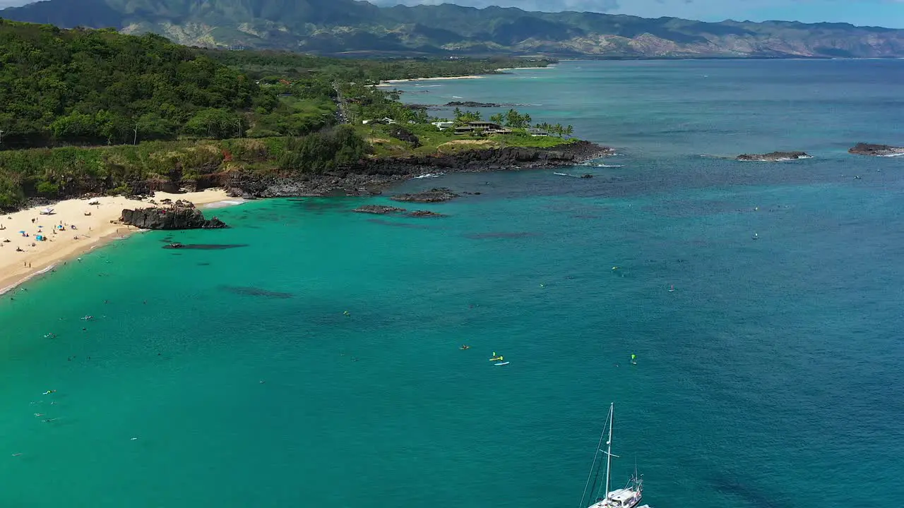 Panning aerial view of Waimea Bay and the North Shore on the island of Oahu Hawaii