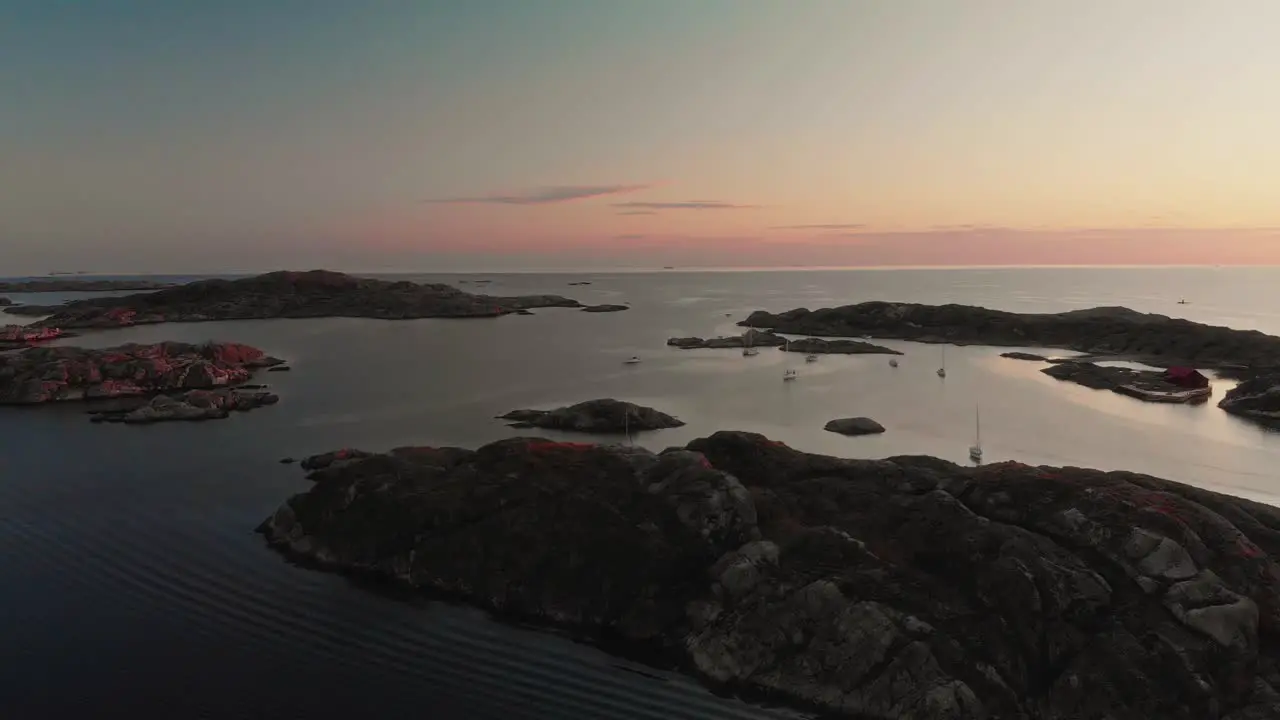 drone flies over Swedish archipelago at sunset in skarhamn