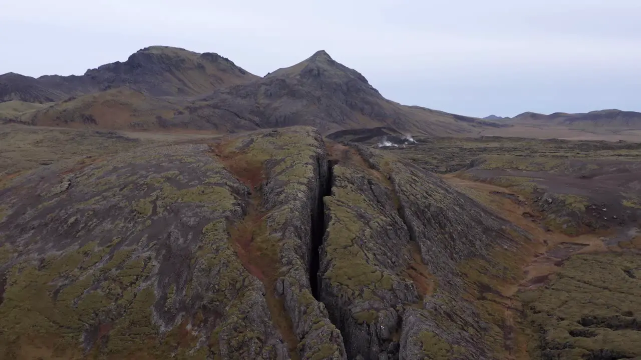 Aerial of famous volcanic Lambafell fissure in Iceland crack in earths surface