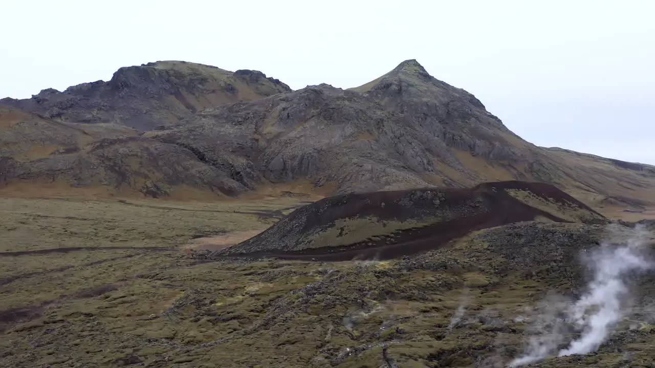 Aerial of wild mountainous landscape of Iceland with steam vents