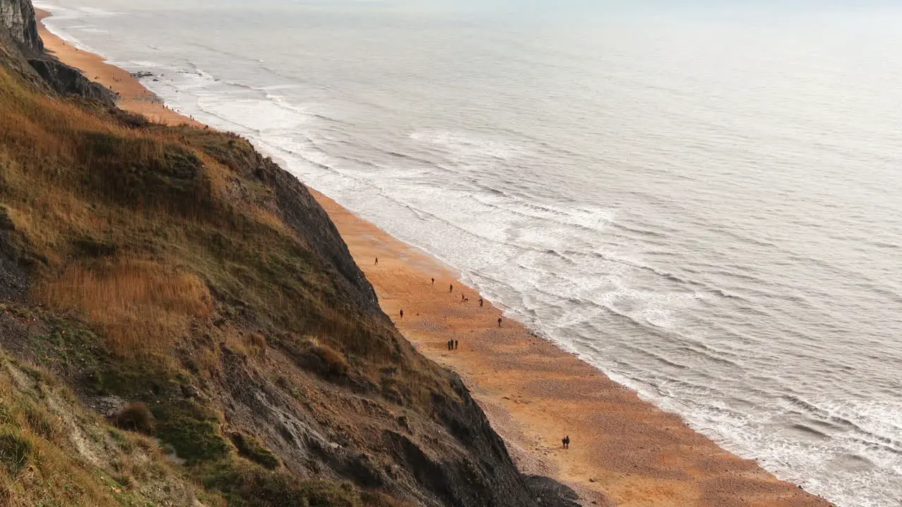 Pan Over Cliffs And Shoreline-Beach In Charmouth Devon