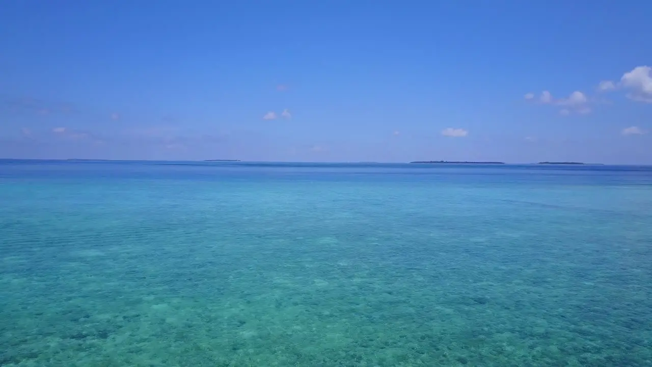 Flying over beautiful vibrant Hawaiian ocean aerial push in 4k