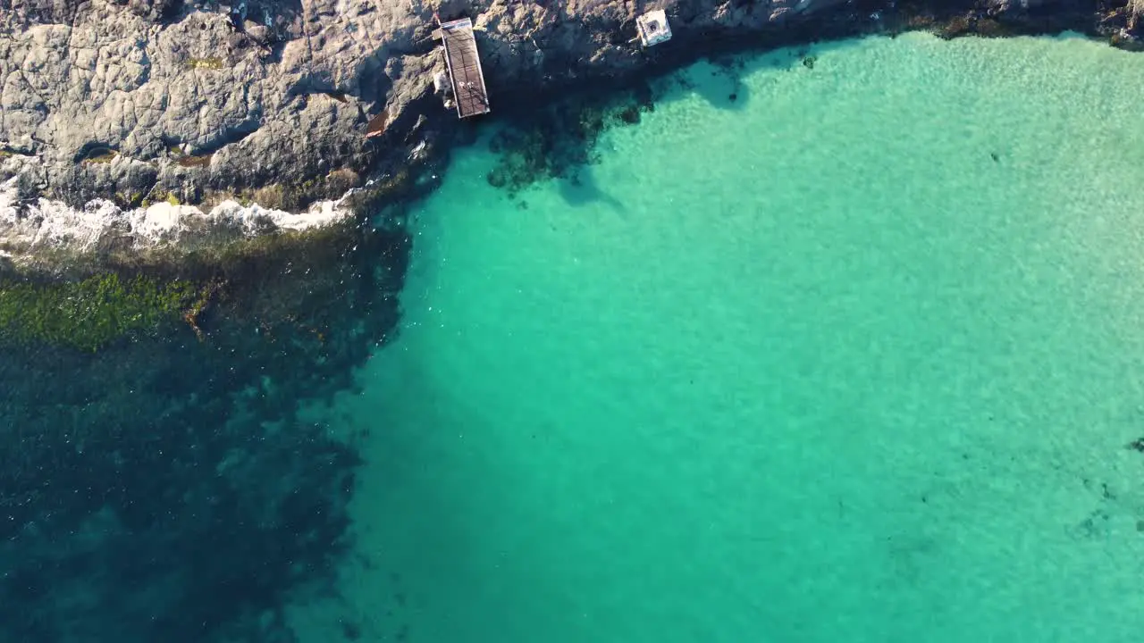 Drone aerial Bawley Point crystal clear reef sand rocks and bridge Pacific Ocean Sydney South Coast Ulladulla NSW Australia 4K