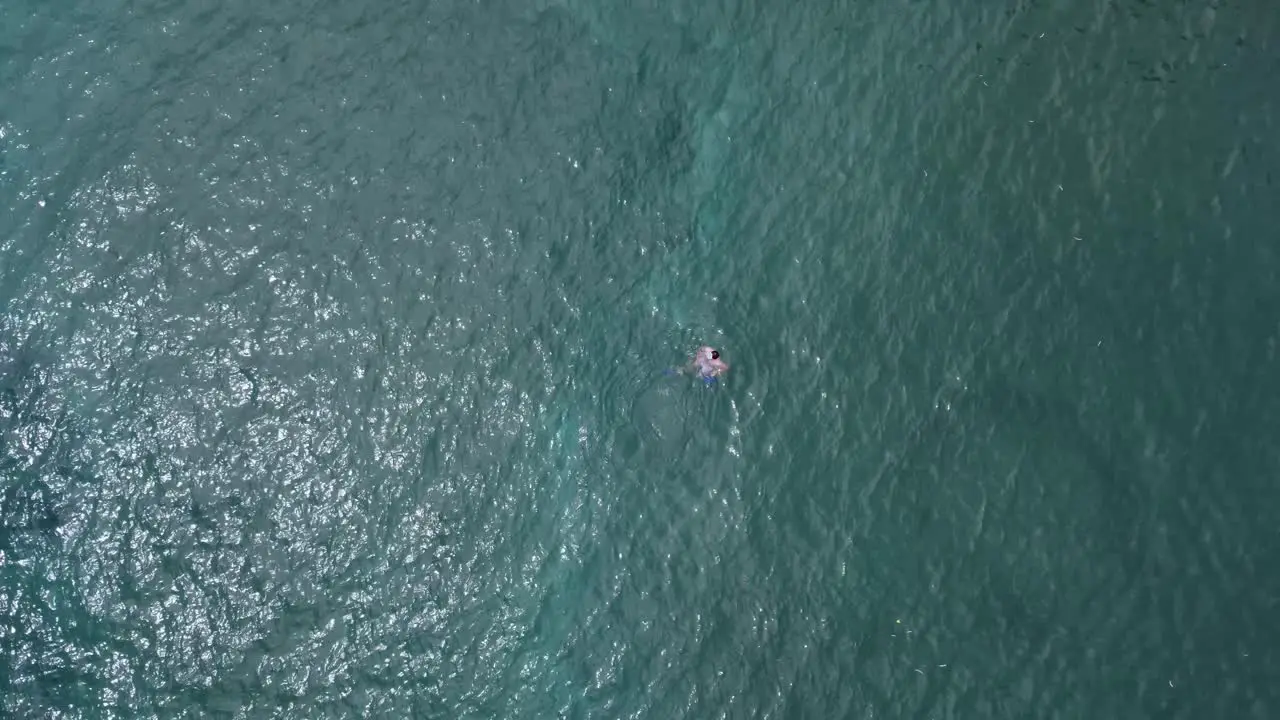 Boy swimming at the coast of Maui