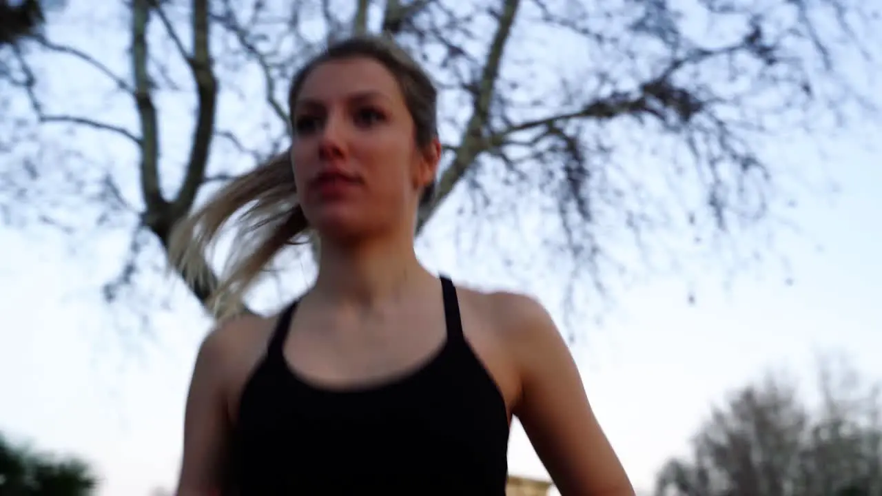 Young Female Athlete With Ponytail Cardio Training Outdoor Close Up