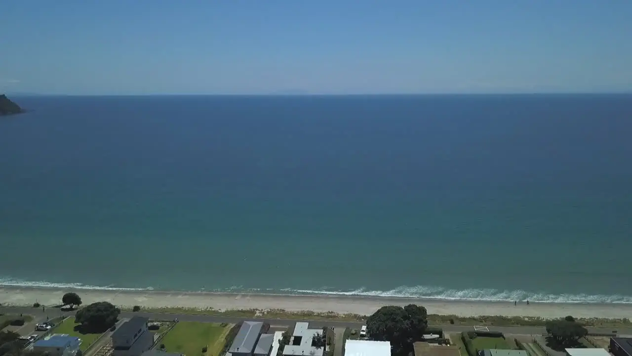 Drone travelling on the top of beach village and finish on the top of the sea