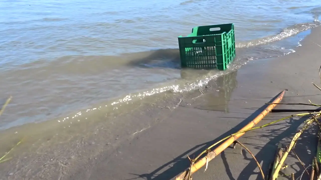 a Washed up plastic crate on a beach