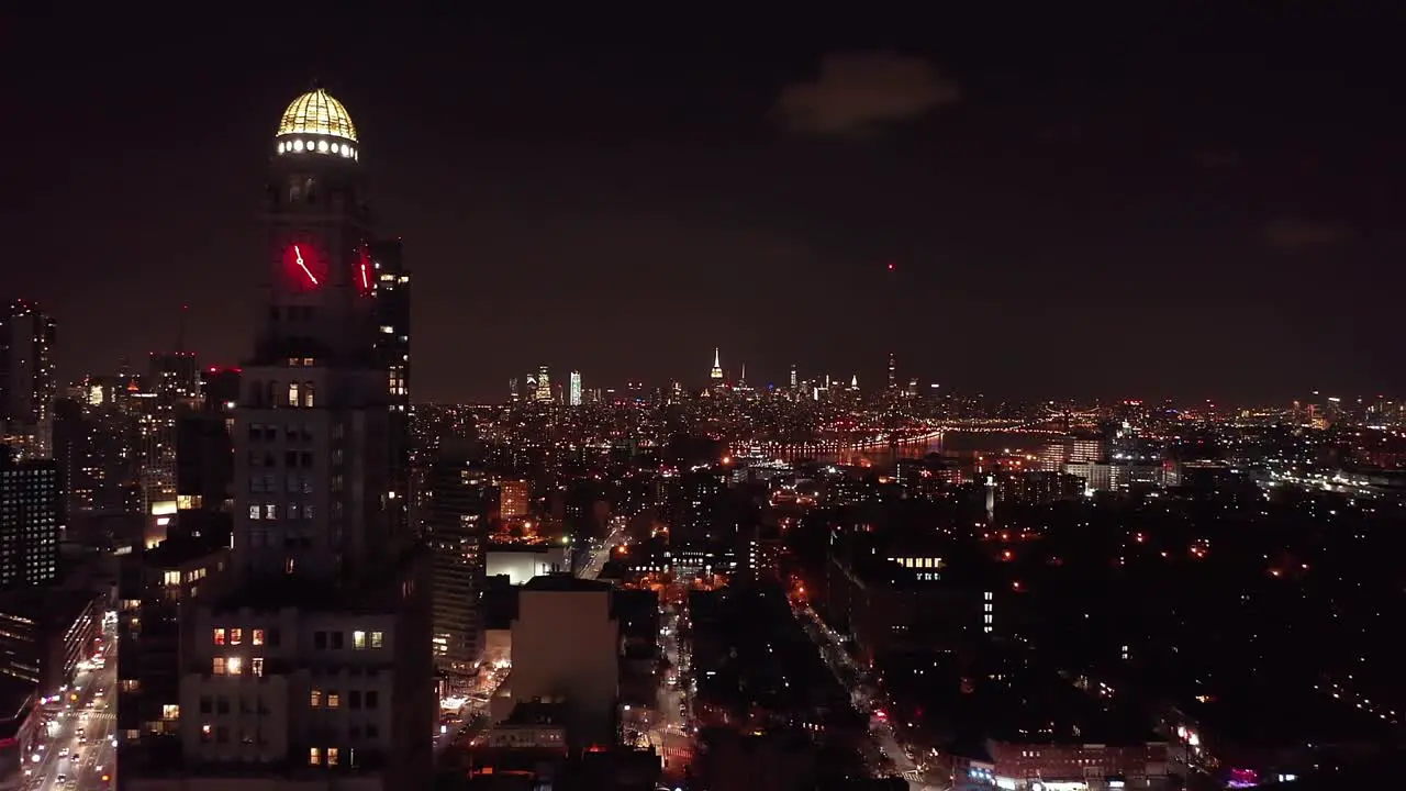 Drone footage of the Brooklyn and Manhattan city skyline at night taken from Brooklyn New York