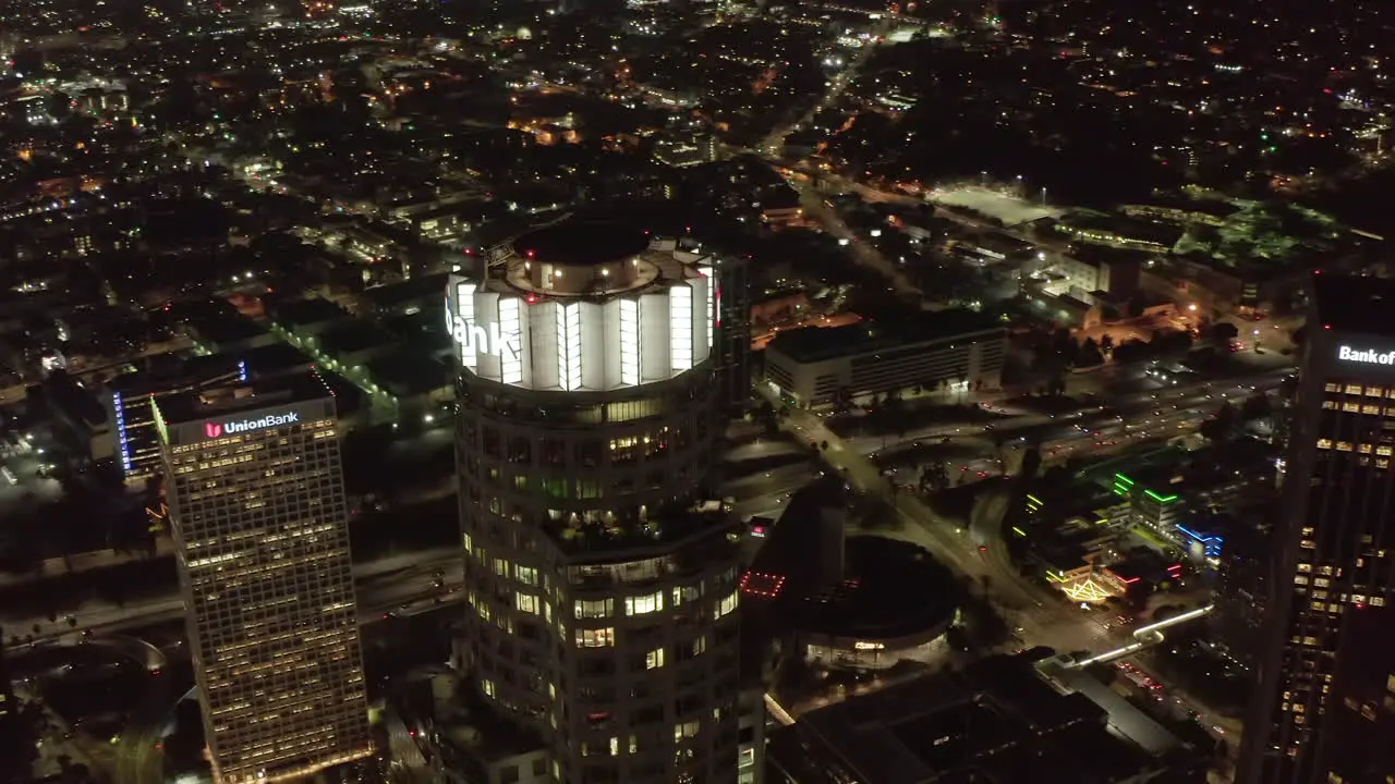 Big Skyscraper Towers in an American City metropolitan Area at Night with lit up Streets Aerial Drone View from Above Los Angeles Circa 2019