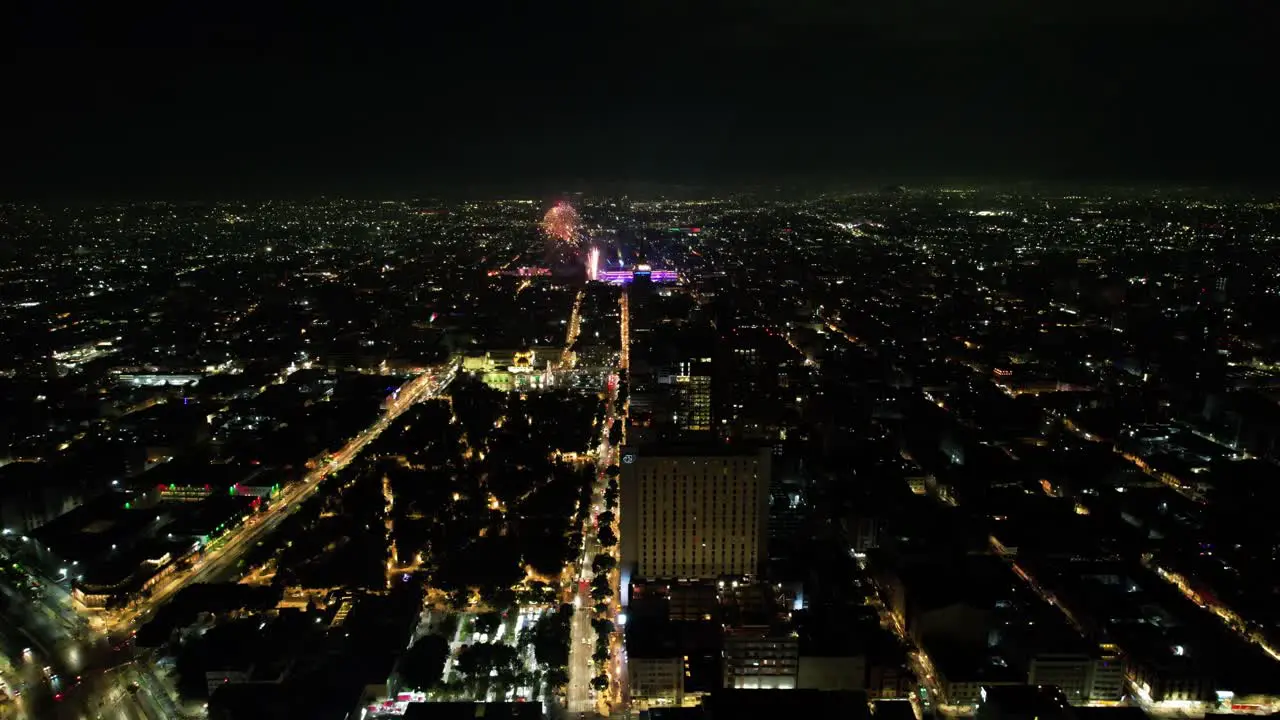 drone shot of fireworks demonstration at mexico city zocalo and alameda central during independence day celebration