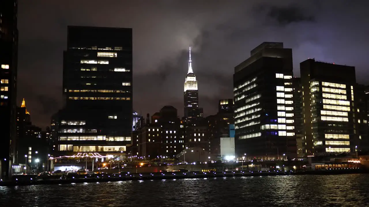 Passing the Empire State Building at night on the East River