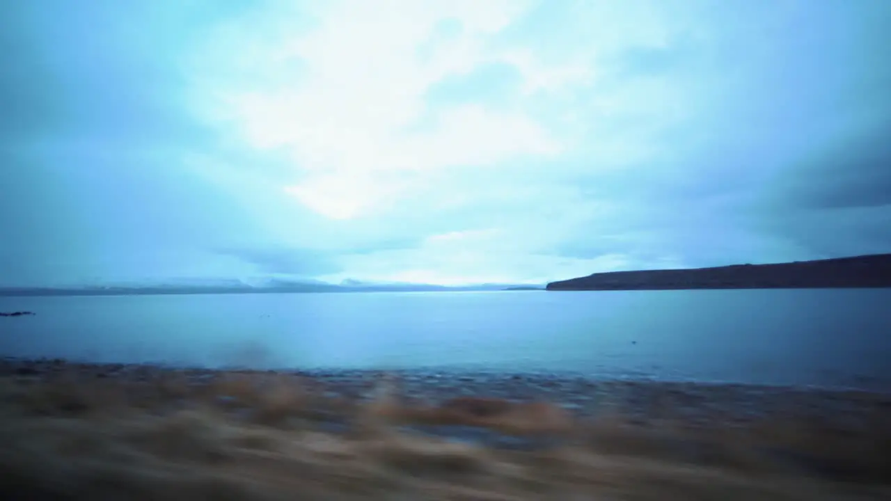 View from the car while driving on the ocean shore in Iceland