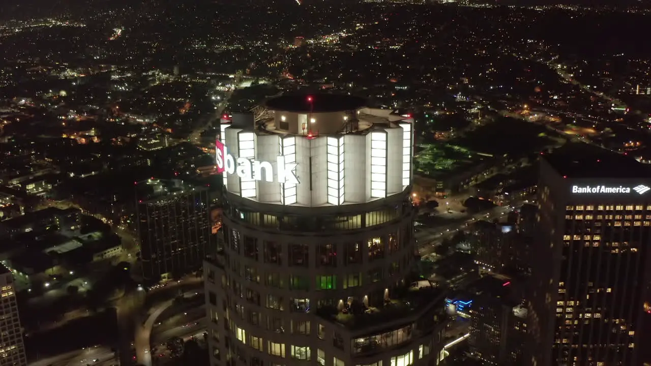 Aerial Establishing Shot of Famous US Bank Tower Building in Los Angeles Skyline at Night Skyscraper Wide View with Cityscape and Mountains in background Circa 2019