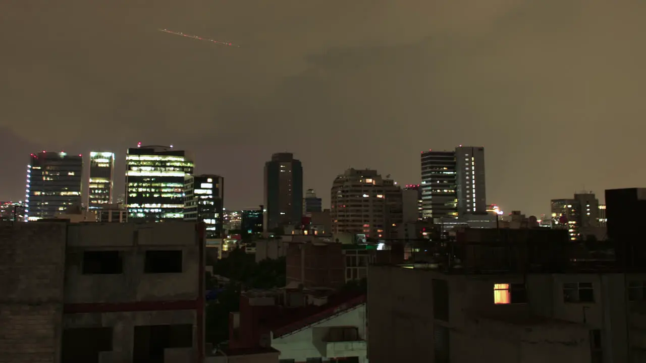 Panning Timelapse of Planes Flying During the Evening as Lighting Begins to Strike Over City