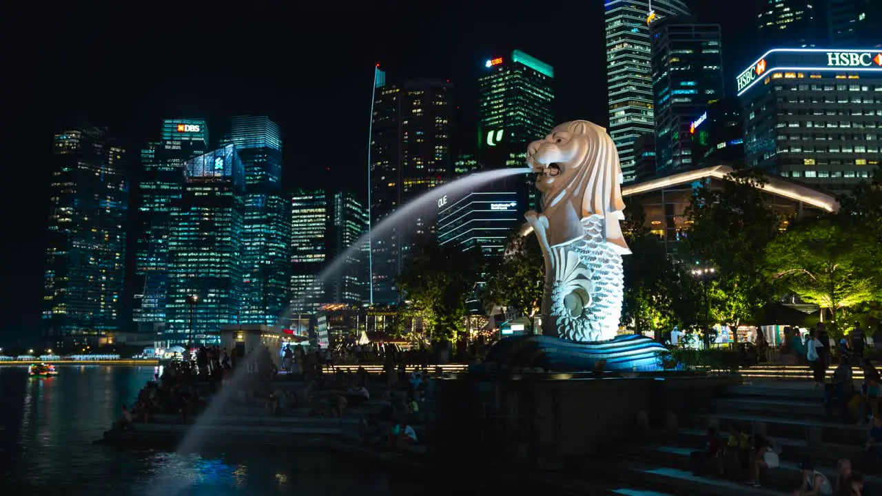 A timelapse of the Merlion in Singapore with a view of the city behind