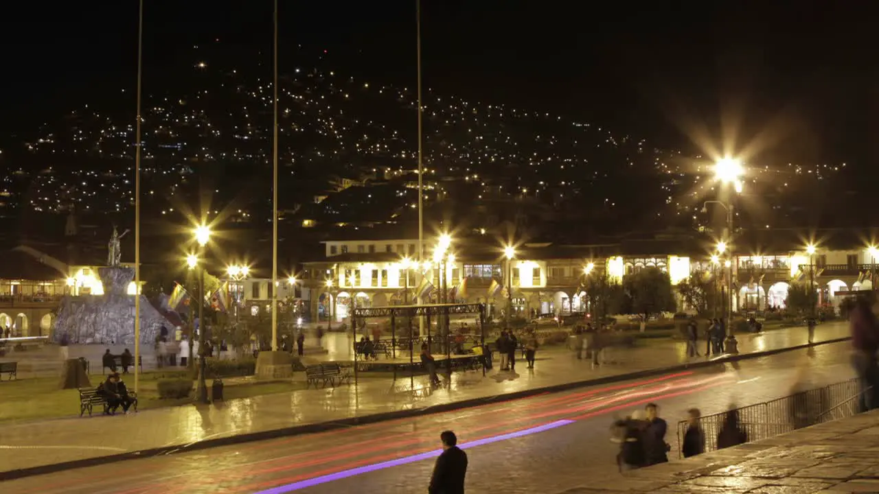 Plaza de armas with people and cars passing