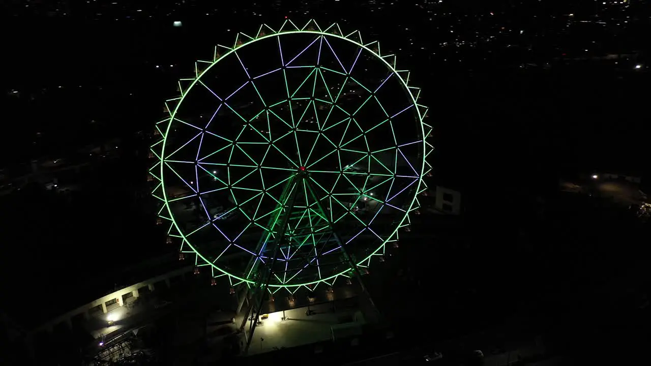 Aerial night panorama Vibrant Ferris wheel at Aztlan Parque Urbano Chapultepec