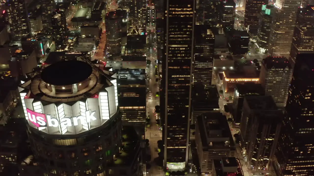 Incredible Wide Angle Aerial Shot of Los Angeles California Skyscrapers at Night in beautiful City Skyline with Tower Rooftops Drone Dolly right Circa 2019