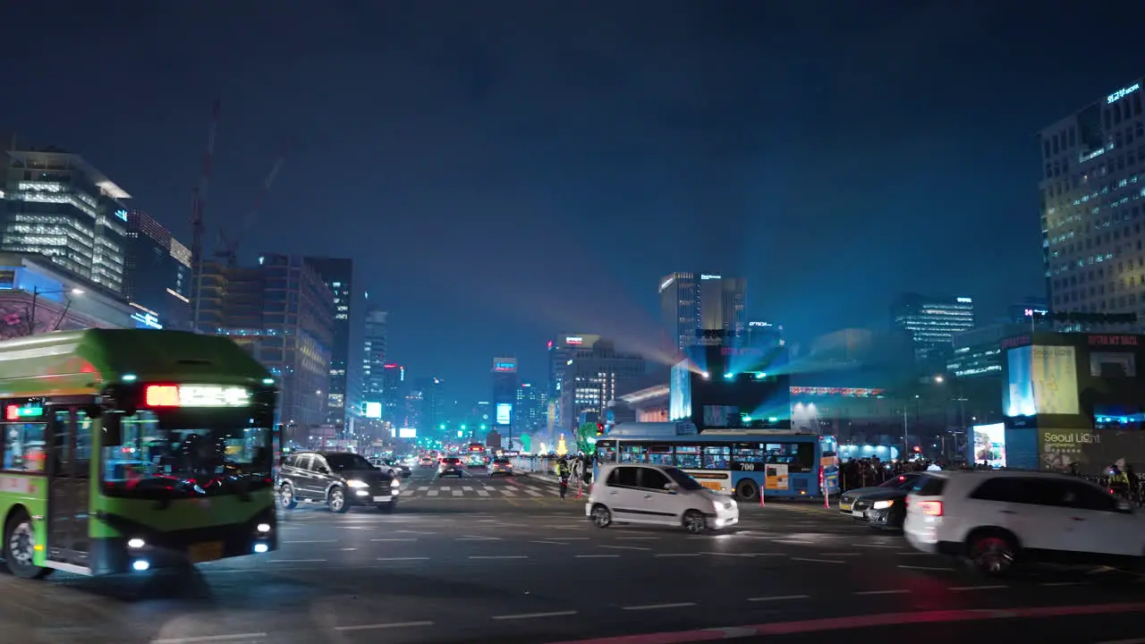 Night Car Traffic on Sejong-daero Road Near Gwanghwamun Gate During Seoul Light Festival in Gwanghwamun Square panning