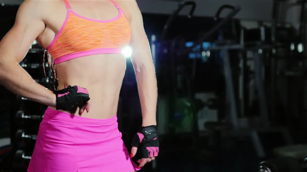 Portrait Of A Female Athlete He Looks Into The Camera Standing In The Gym