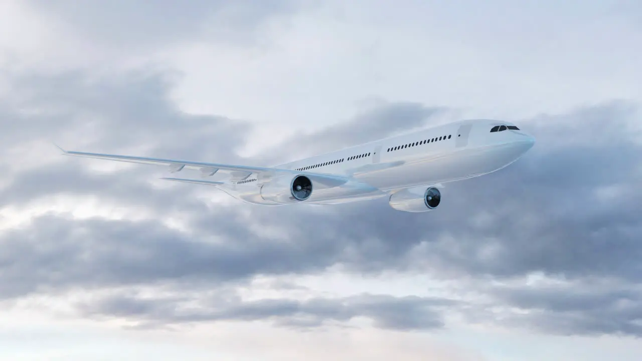 Side view of a commercial airplane flying fast above the clouds