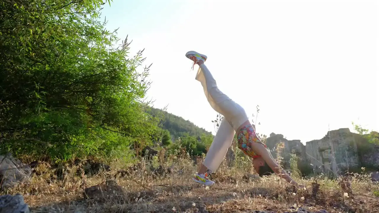 a woman doing yoga and stretches in a natural space