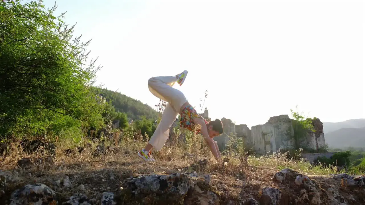 woman does yoga stretches in a natural space