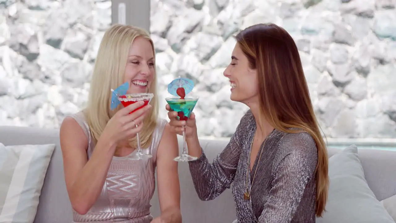 Smiling women drinking cocktail