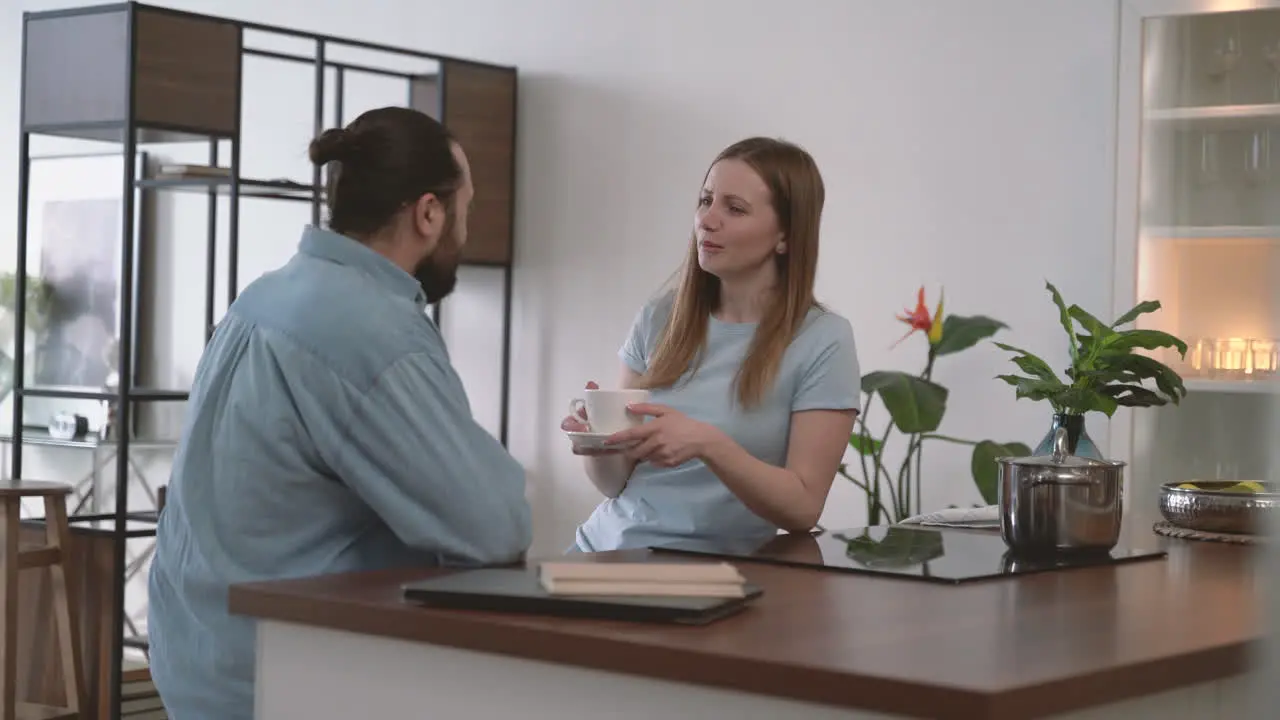 Attractive Brunette Woman Has An Interesting Conversation With A Young Woman While Having A Coffee