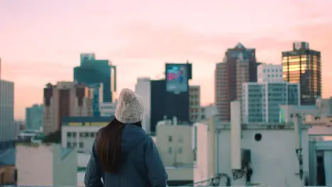 Girl city and buildings with sunset in sky