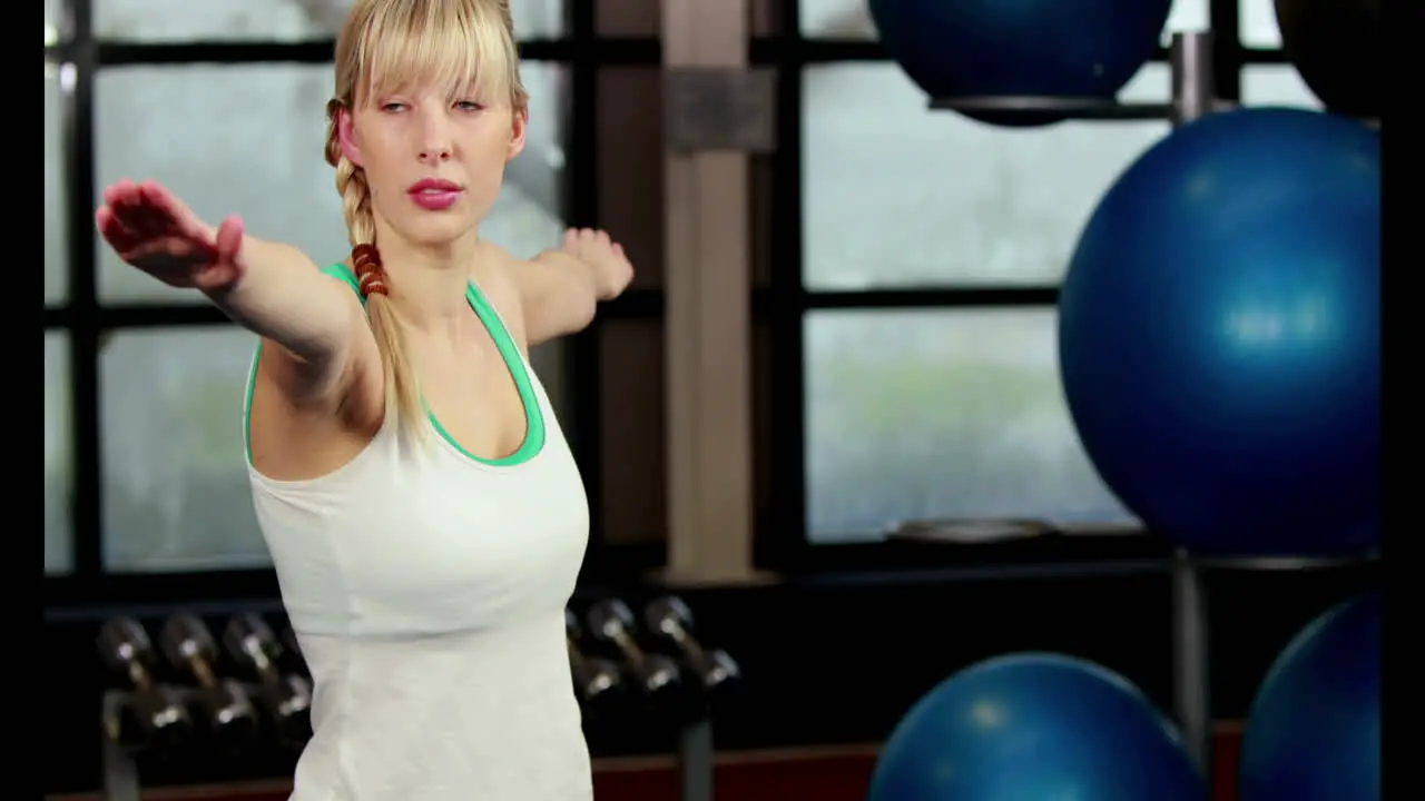 Fit woman doing yoga in the gym