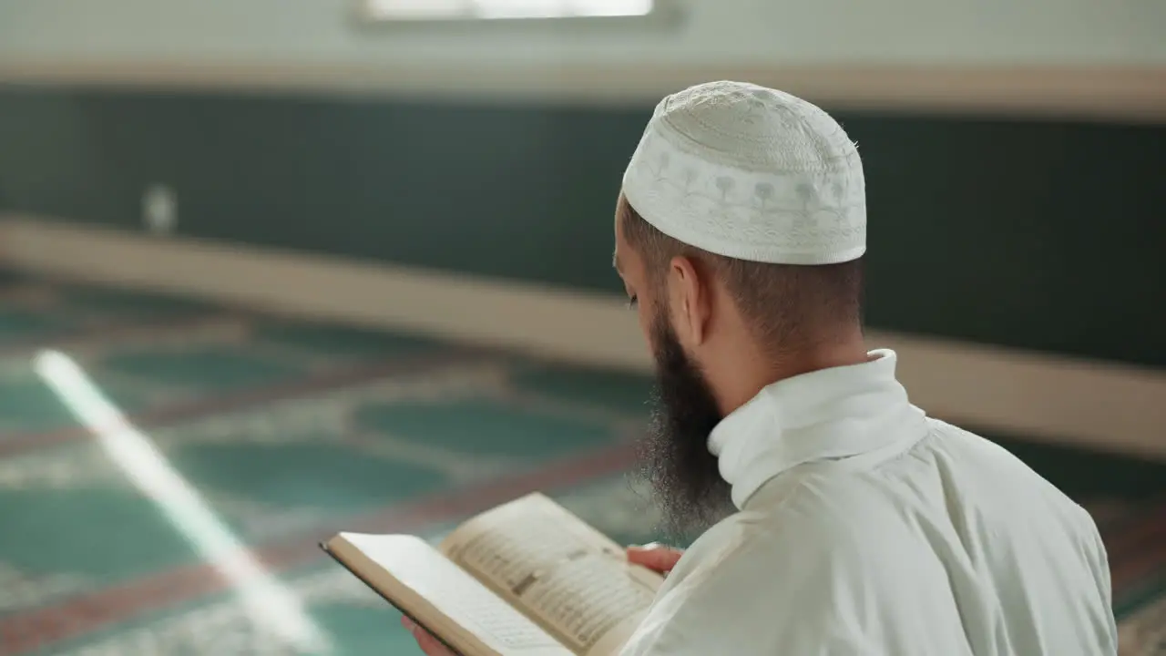 Islamic man kiss quran and mosque for faith