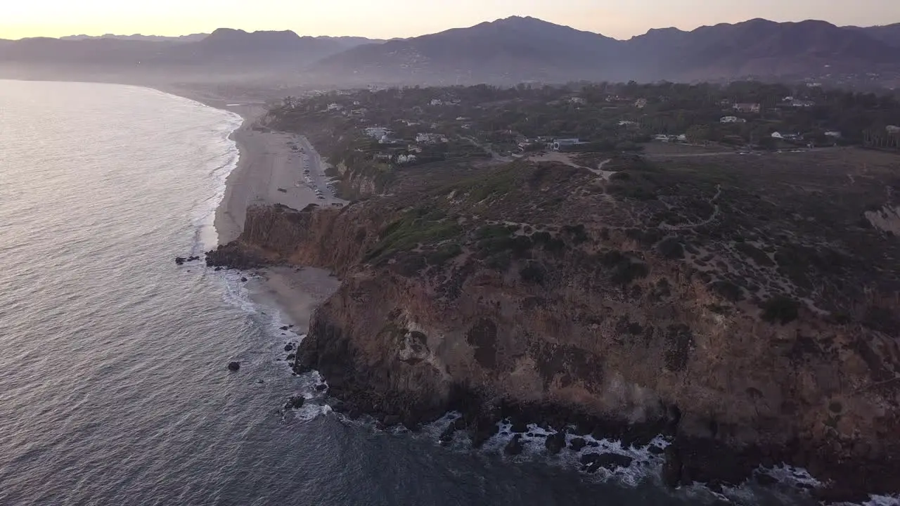 Wide View above Malibu rocky coastline in California at Sunrise Aerial Establishing Shot Wide angle