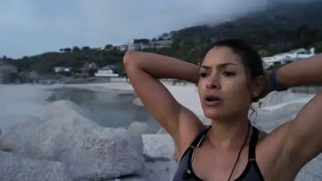 Tired running and fitness woman at a beach