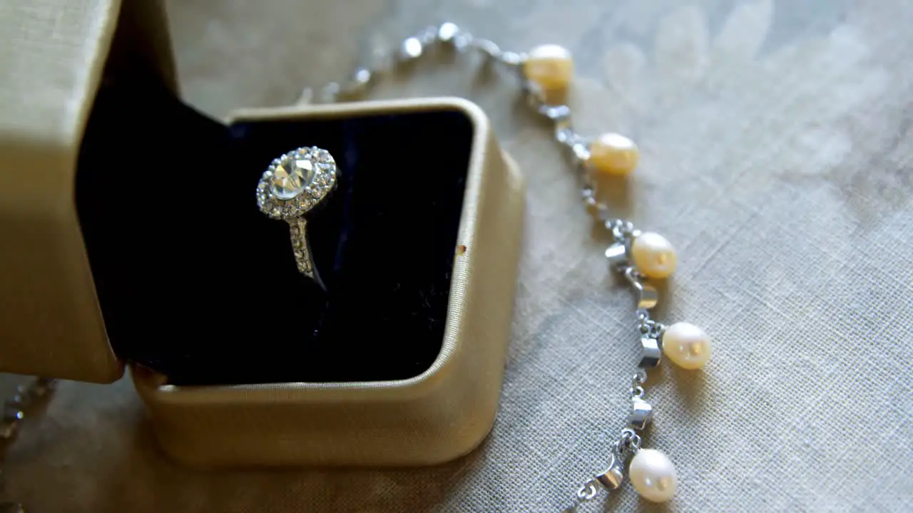 Diamond wedding ring and pearl necklace 4k